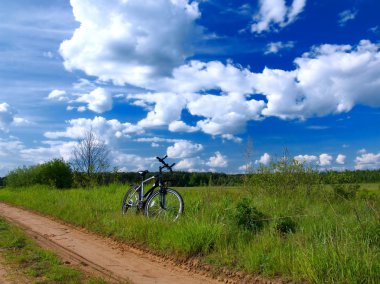 Bicycle in countryside clipart