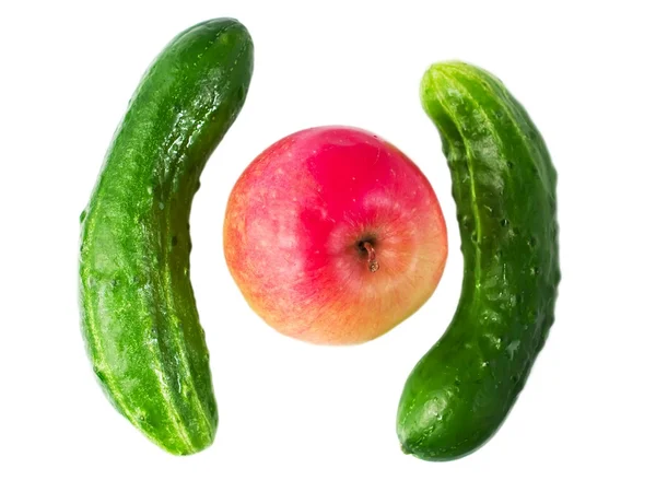 Cucumbers and apple — Stock Photo, Image
