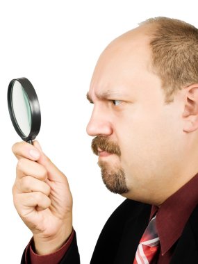 Businessman with magnifying glass clipart