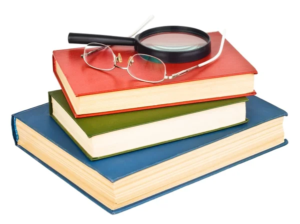 Brýle na hromadě knih — Stock fotografie