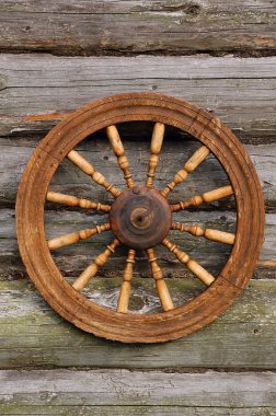 Spinning Wheel On The Blockhouse Wall clipart
