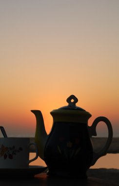 Tea Set At Sunset clipart