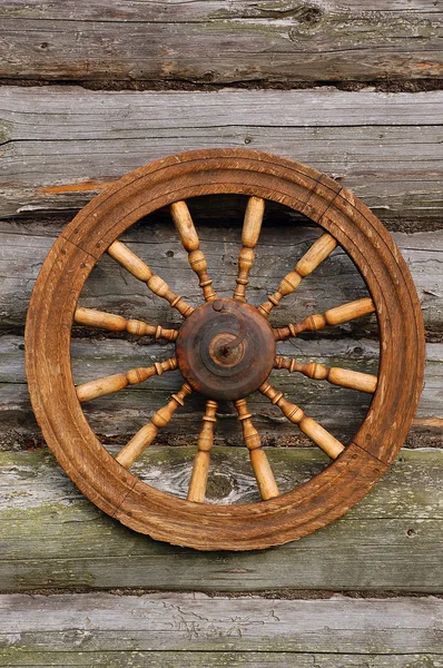 stock image Spinning Wheel On The Blockhouse Wall