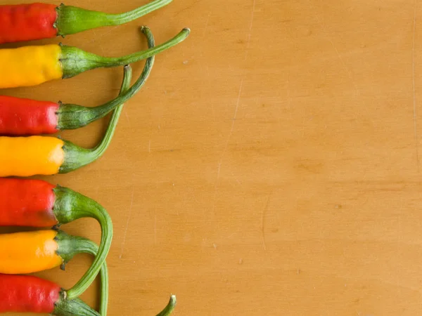 Red and yellow chili peppers — Stock Photo, Image