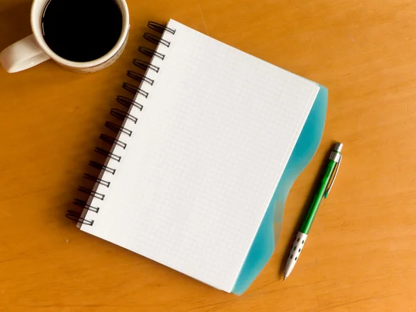 Filiżankę kawy i notebooków — Zdjęcie stockowe