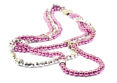 Pink plastic necklace on white backgroun clipart