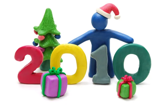 Text 2010, vánoční stromek a dárky — Stock fotografie