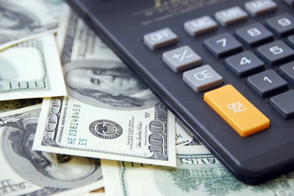 Calculator op geld achtergrond Stockfoto