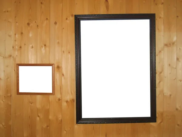 Prázdné rámečky na dřevěné stěně — Stock fotografie