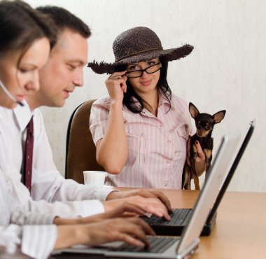 A young man and woman operatin laptops a clipart