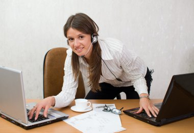 Quick smart girl at the office desk with clipart