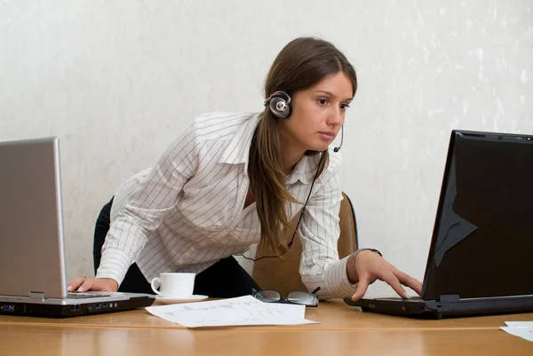 Young businesswoman in the office with t — Stock Photo, Image