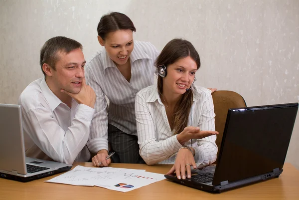 Group of employees in the office with la — Stock Photo, Image