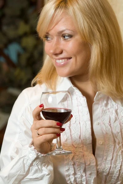 Beautiful girl with a glass of wine — Stock Photo, Image