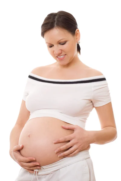 Gülümseyen hamile kadın ayakta — Stok fotoğraf