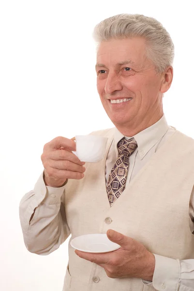 Geschäftsmann trinkt auf einem weißen — Stockfoto
