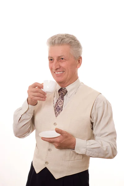 Бізнесмен п'є з чашки — стокове фото
