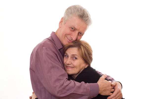 Elderly man embraces a woman — Stock Photo, Image