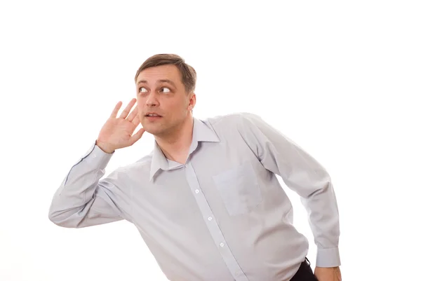 Man stands and listens on a white — Stock Photo, Image