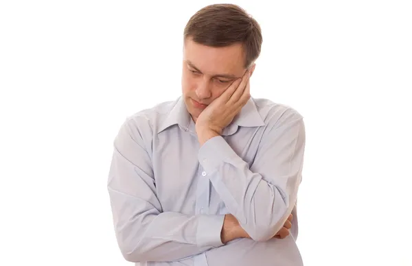 Distraught man standing on a white — Stock Photo, Image