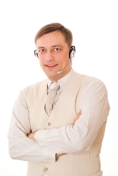 Homem com fone de ouvido falando em um branco — Fotografia de Stock