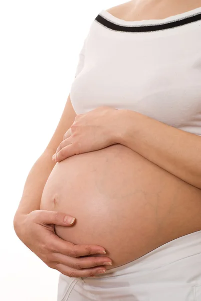 怀孕的女人拿着肚子 — 图库照片