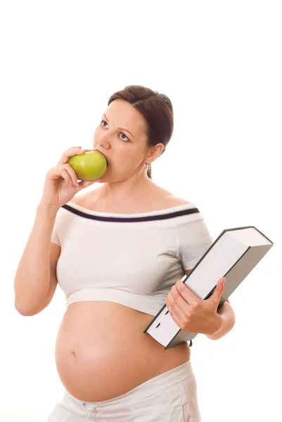 Беременная женщина с зелёной книгой — стоковое фото