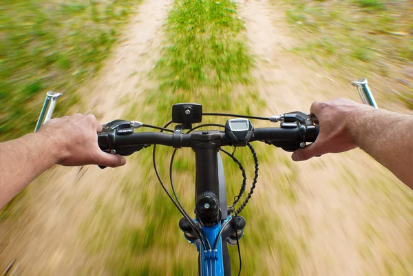 Mounting biking on the dirt road — Stock Photo, Image