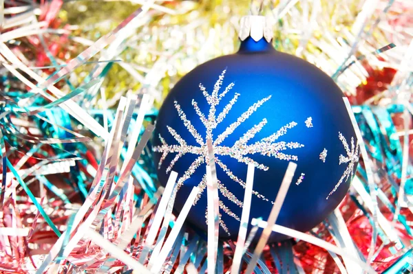 Blue christmas ball on the shiny decorat — Stock Photo, Image