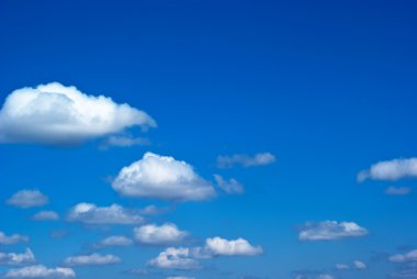 Blue sky with clouds and sunlight clipart