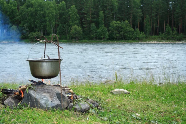 stock image Kettle at the river