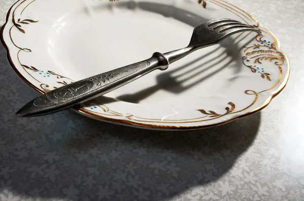 Tenedor con plato — Foto de Stock