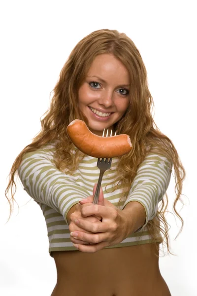 Girl eats sausage — Stock Photo, Image