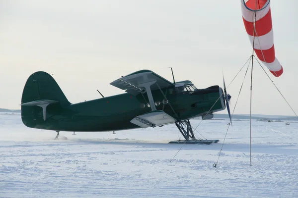 Stock image Plane with skis on the snow