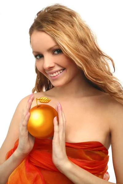 Flicka som håller en gyllene äpple Stockbild
