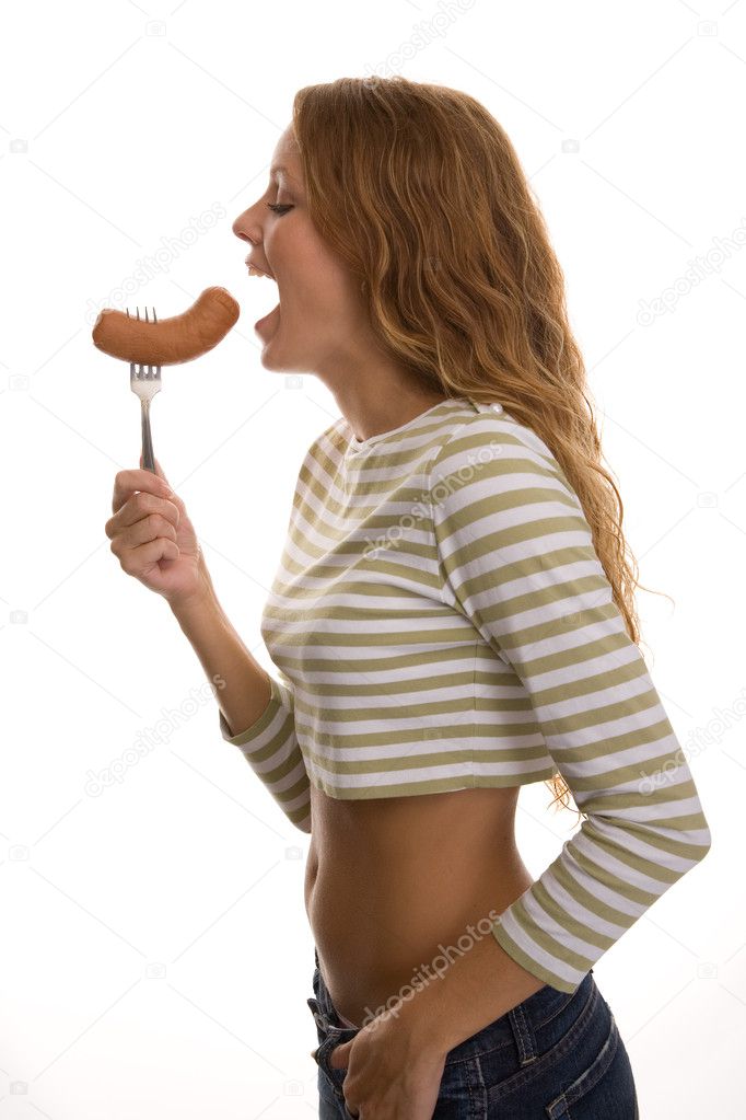 Girl eats sausage