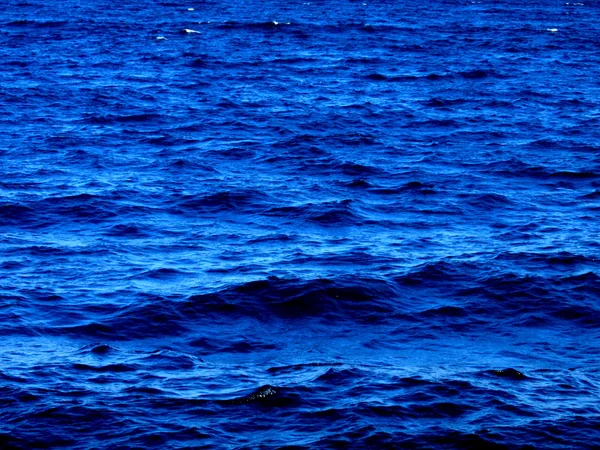 stock image Small waves on the blue sea