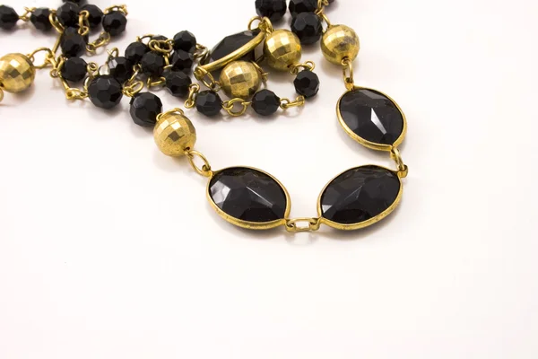 Black and gold necklace — Stock Photo, Image