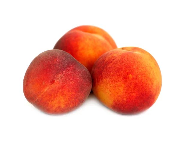 Три персика — стоковое фото