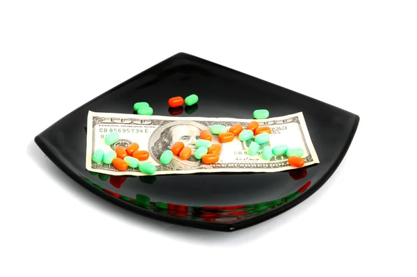 Thai pills on black plate — Stock Photo, Image