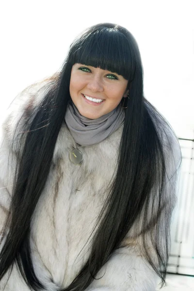 Pretty girl in fur coat — Stock Photo, Image