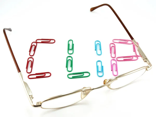 Glasses and word from office clips — Stock Photo, Image