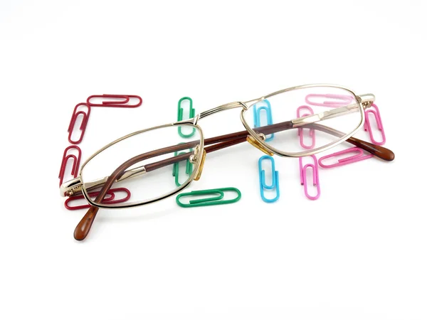 Óculos e palavra de clipes de escritório — Fotografia de Stock