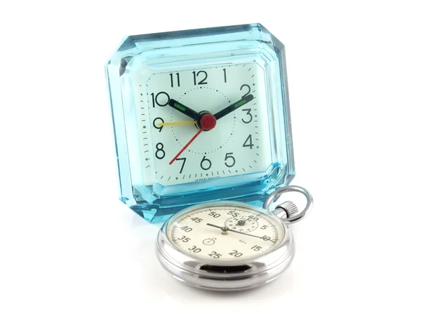 Старые настольные часы и секундомер — стоковое фото