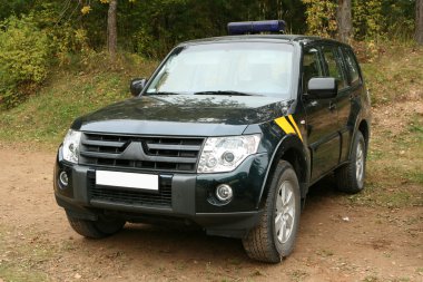 Special force`s patrol jeep in forest. clipart