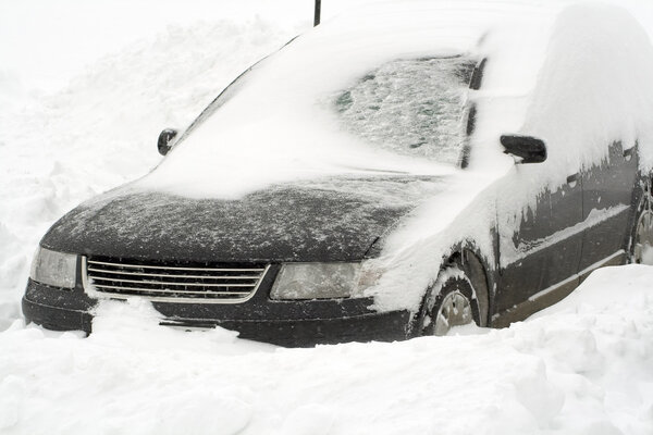 European car in snowbank.