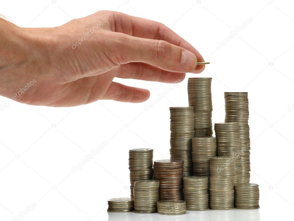 Hand placing coin on stack of coins