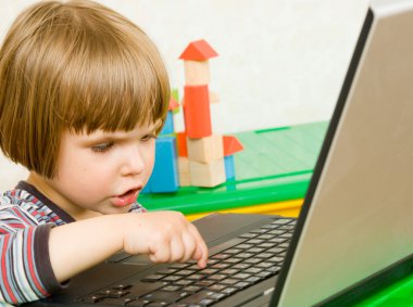 Child with laptop clipart