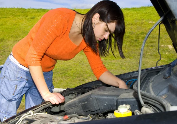 Stock image Woman repairing a motor vehicle