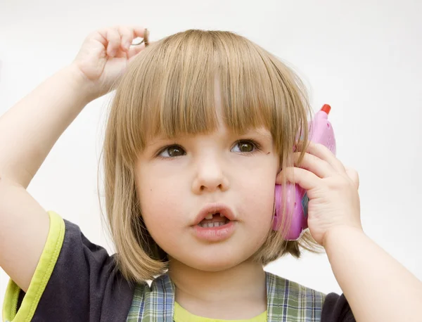 Dziecko z telefon zabawka — Zdjęcie stockowe